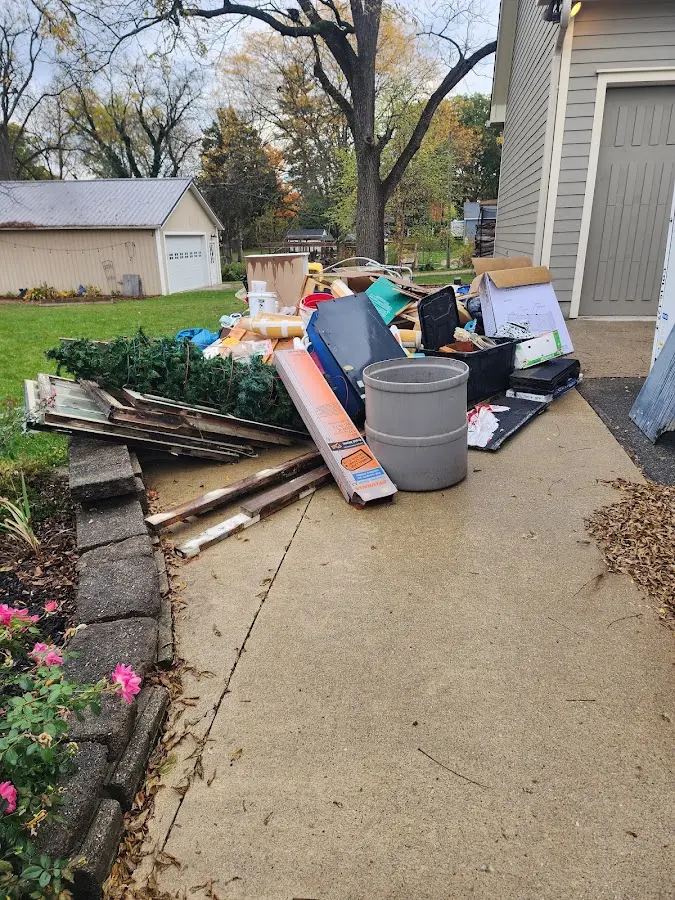 Dumpster being loaded with debris for Residential Dumpster Rental in Lexington
